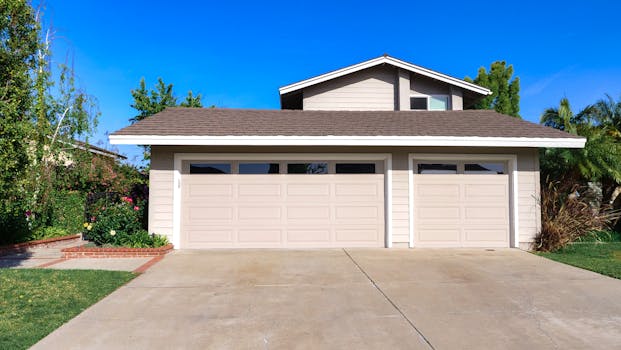 house with a “for sale” sign in front