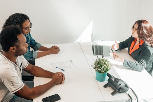 couple signing mortgage documents