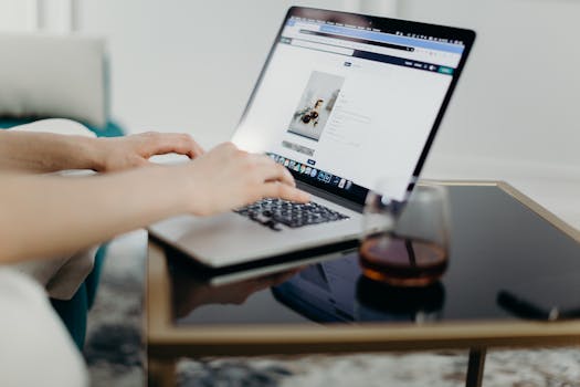 person using a laptop to check mortgage details online