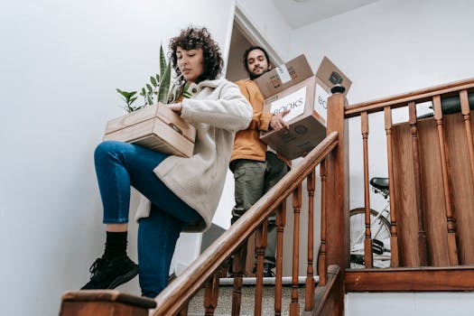 family moving into a new home with a moving truck