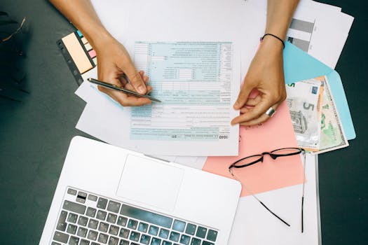 Calculator and documents on a desk for mortgage planning