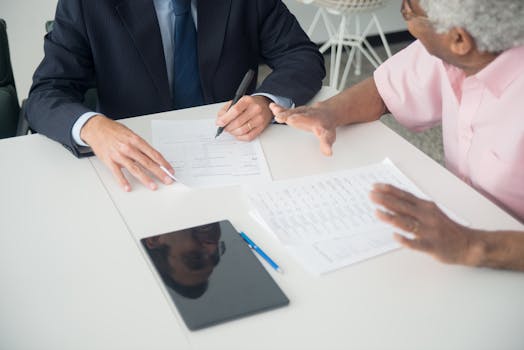 financial advisor reviewing documents with client