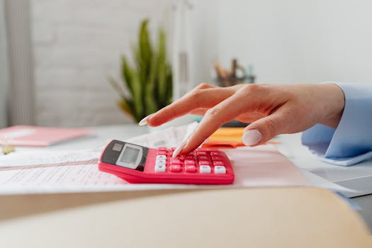 close-up of a calculator and financial documents