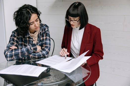 homebuyer reviewing mortgage documents with a magnifying glass