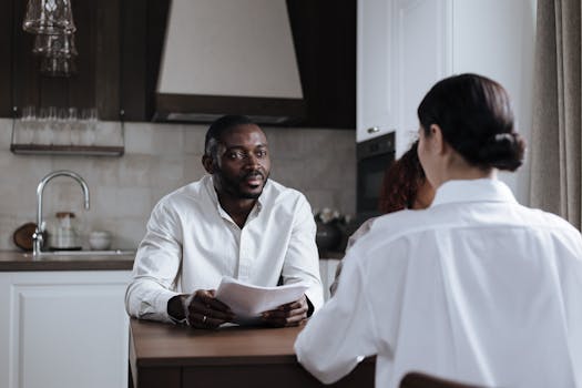 family discussing finances at kitchen table