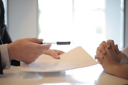 A tax professional assisting a client with paperwork