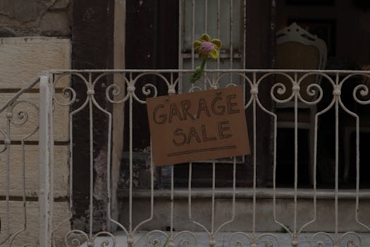 house with a for sale sign in the yard