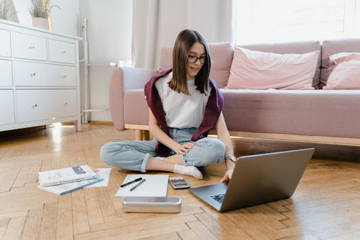 person using a laptop to calculate mortgage payments