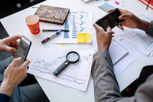 person reviewing financial documents at a desk