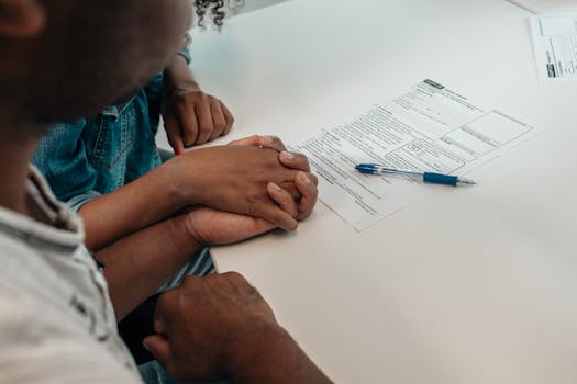 couple signing mortgage documents