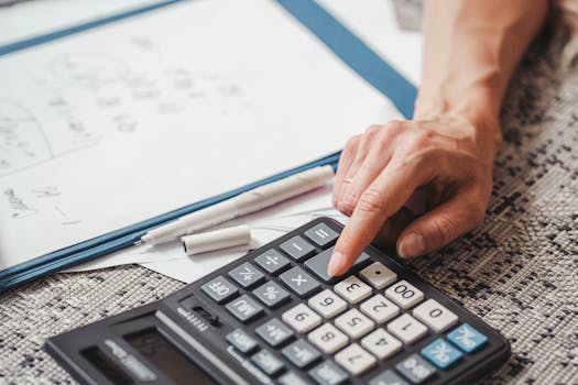 Tax documents and calculator on a desk