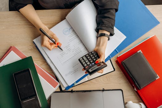 Financial documents and calculator on a desk