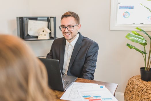 man comparing mortgage rates on laptop