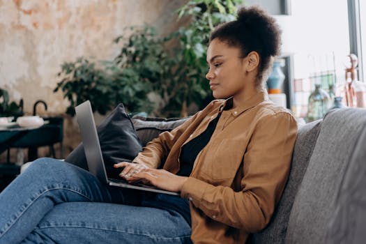 person using laptop to manage finances