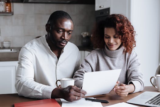 family reviewing budget at kitchen table