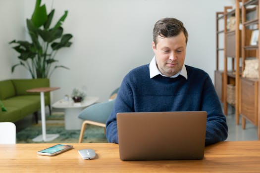 person using a laptop to research mortgages