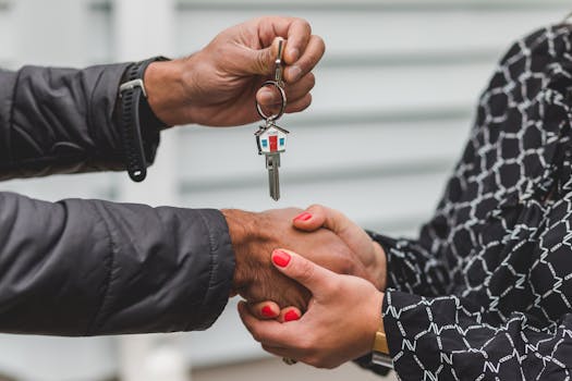 veteran holding keys to new home