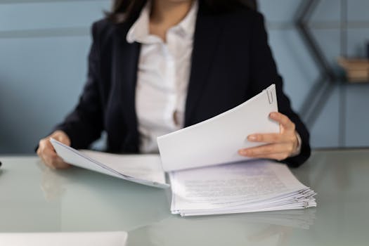 person reviewing tax documents at a desk