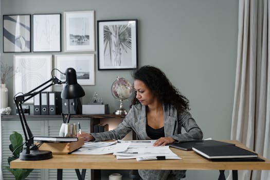 man reviewing mortgage documents on laptop