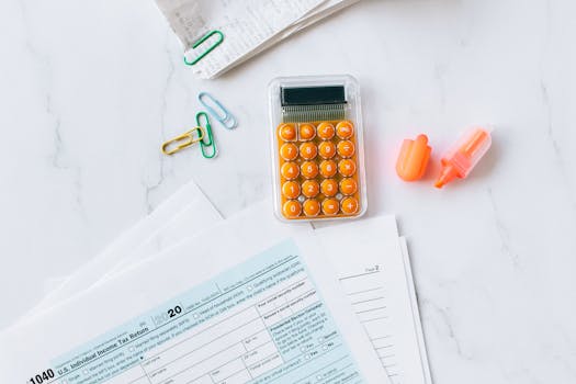 tax forms and calculator on a desk